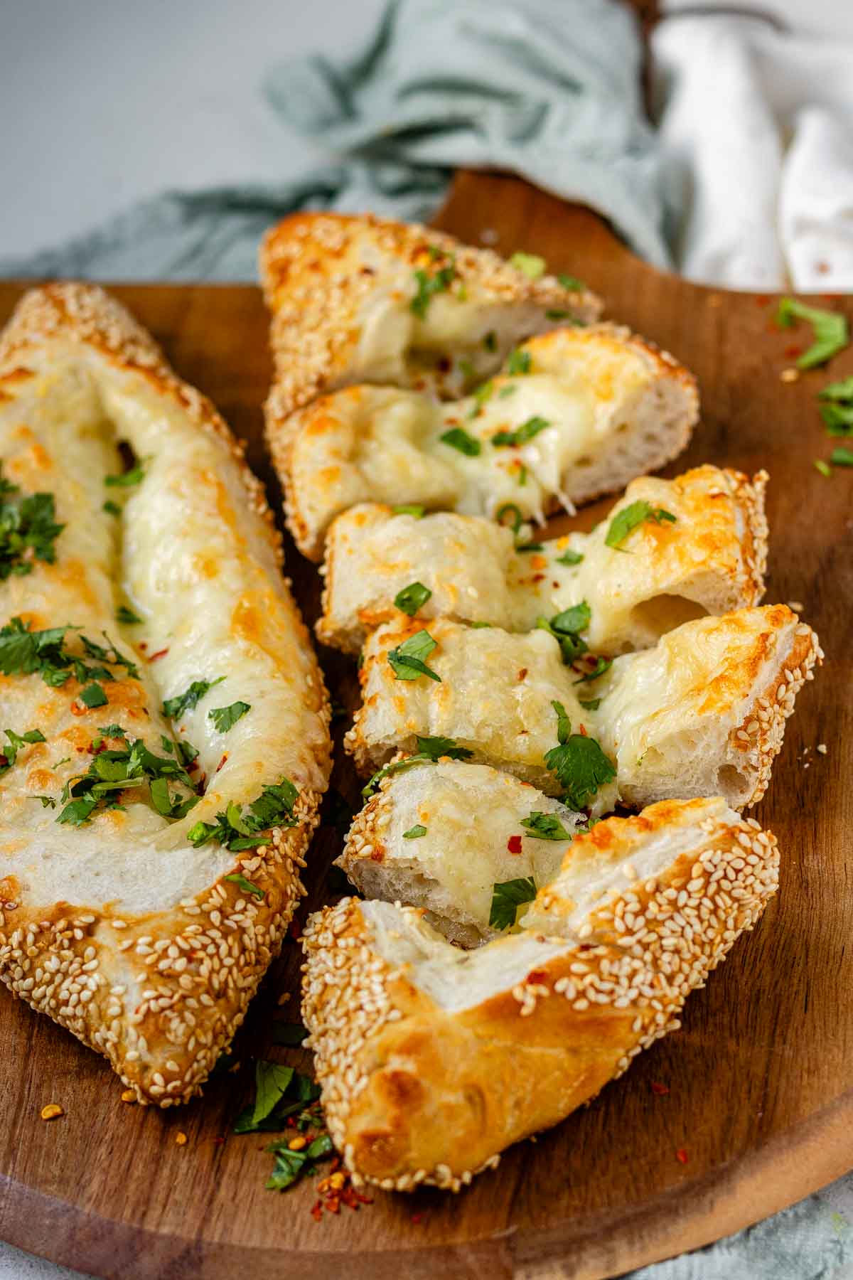 Boat-shaped baked dough filled with melted cheese.