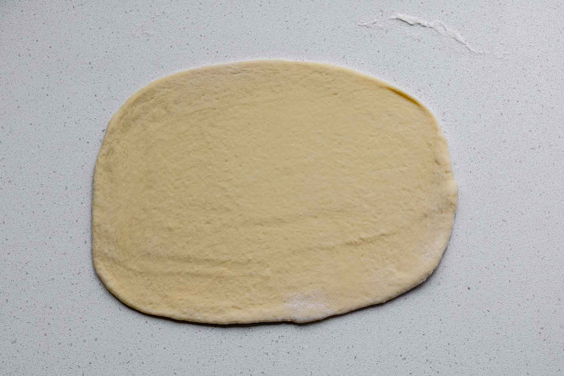 A rolled rectangle of dough.