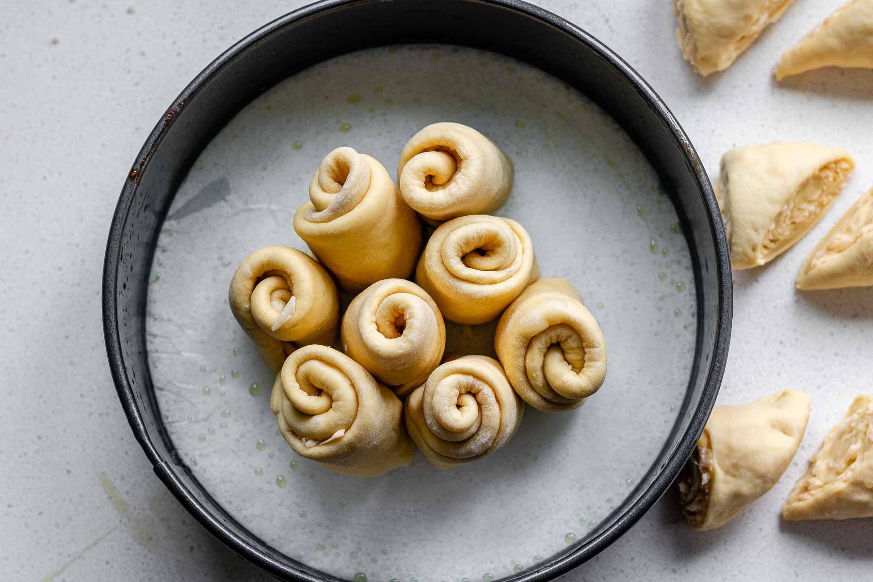 Rolled dough in a baking pan.