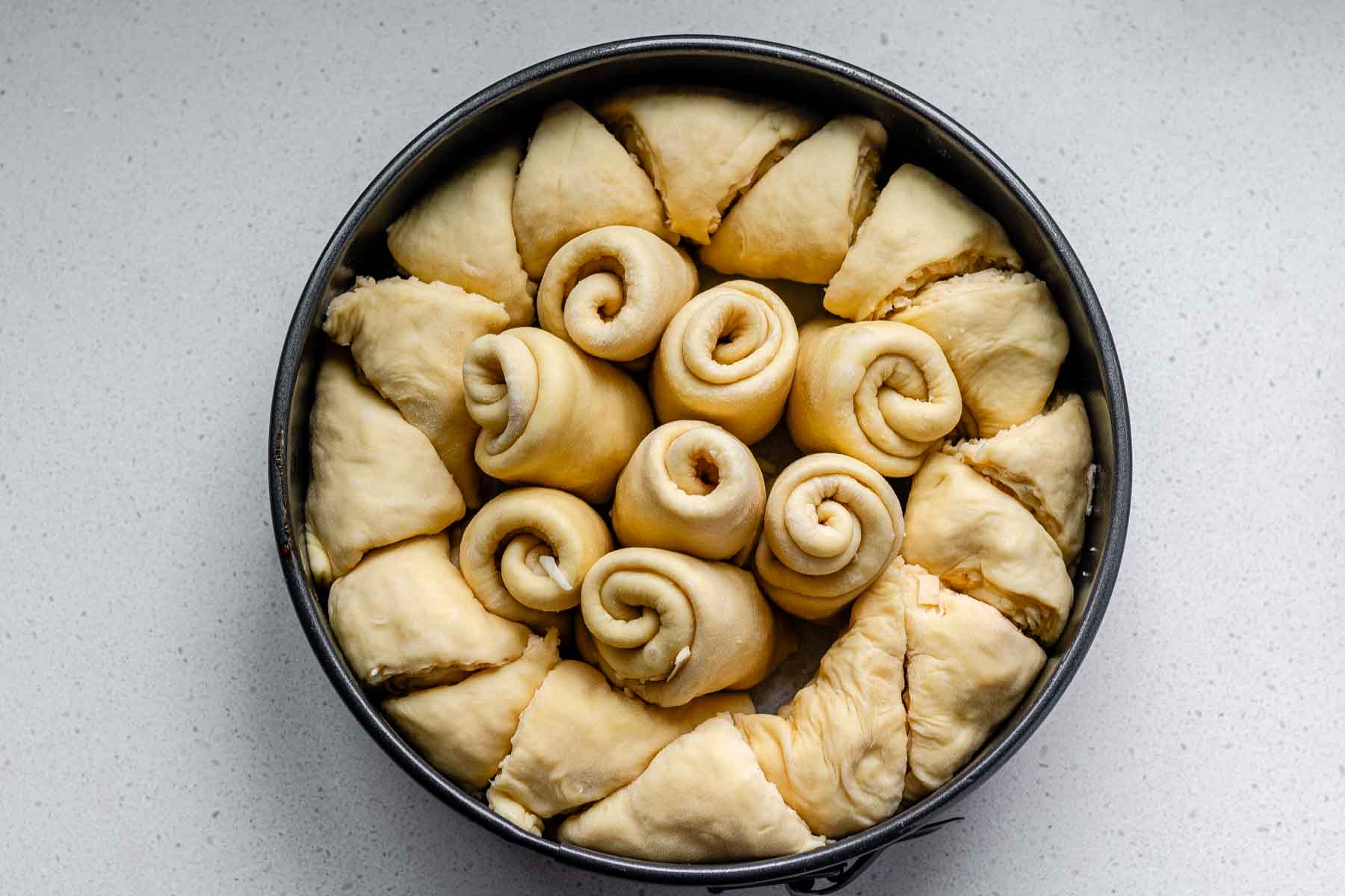 Rolled dough in a baking pan.