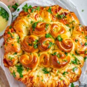 Rolled dough that has been baked and covered with parsley and butter.