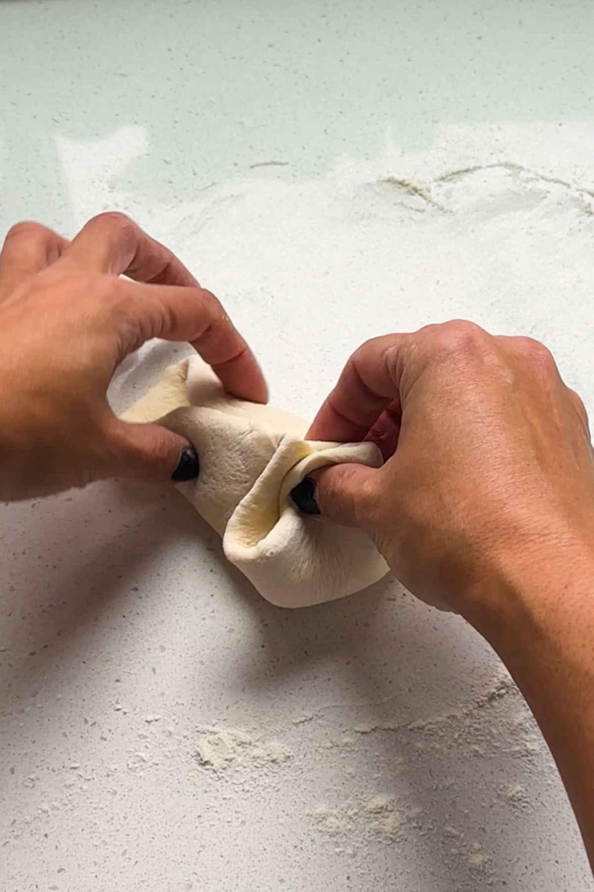 Dough closed up to keep cheese inside.