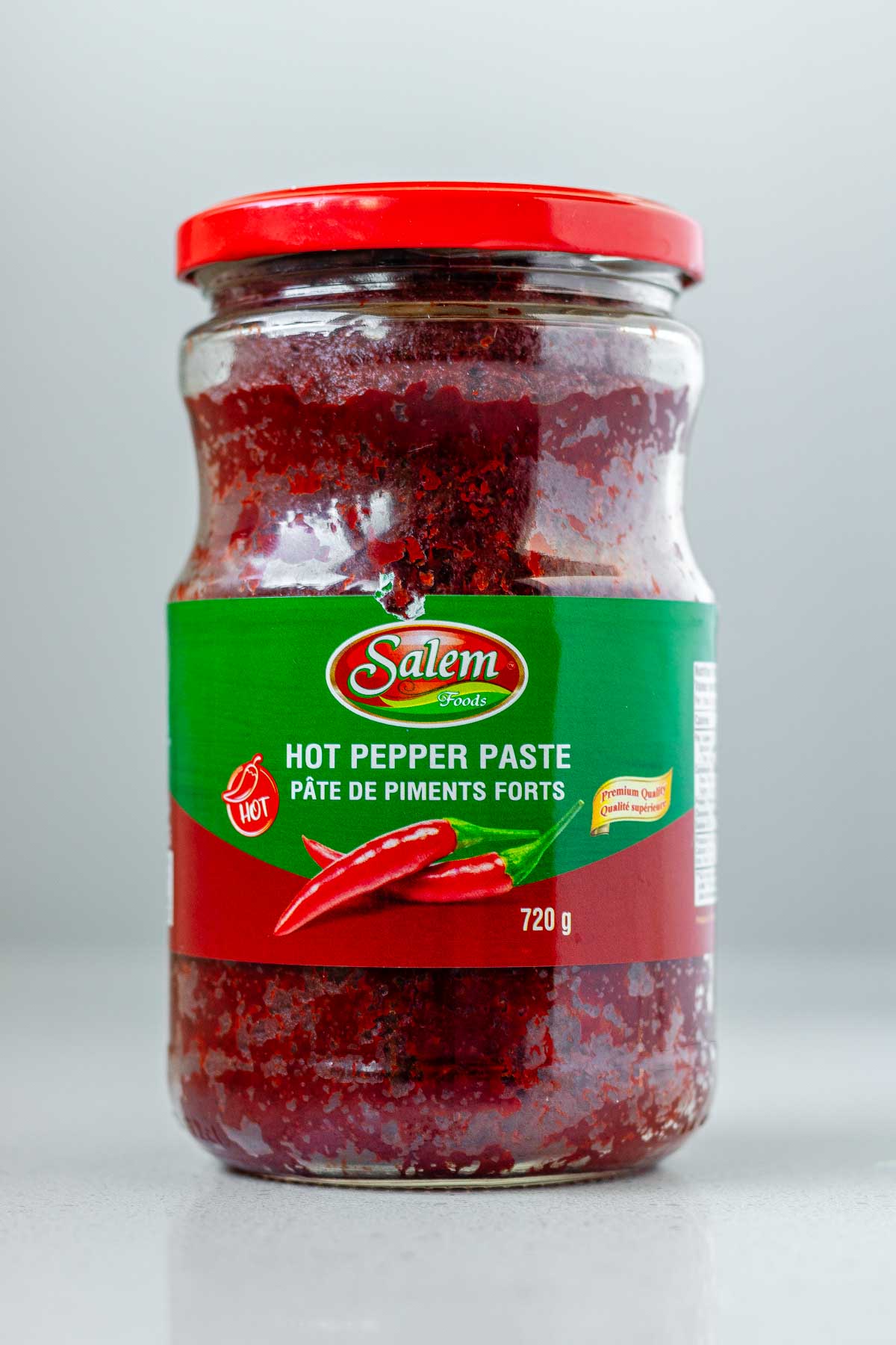A jar of red paste labeled hot pepper paste.