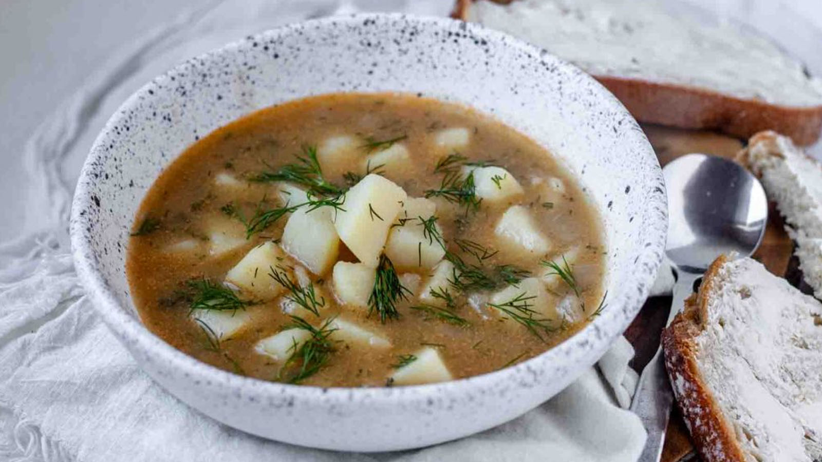 Potato dill soup in a bowl.