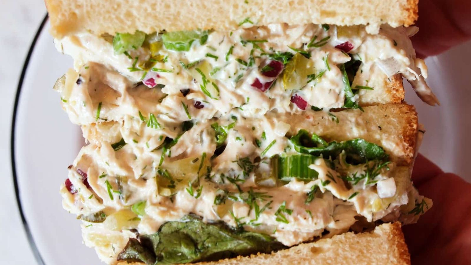 A sandwich filled with chicken salad.