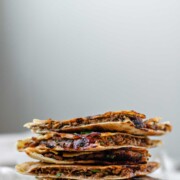 A stack of meat-filled fried pitas.