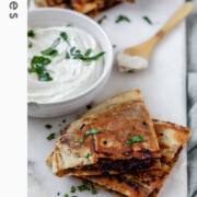 Meat-filled fried pitas with the text arayes.
