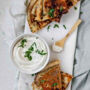 Meat-filled fried pitas with the text arayes.