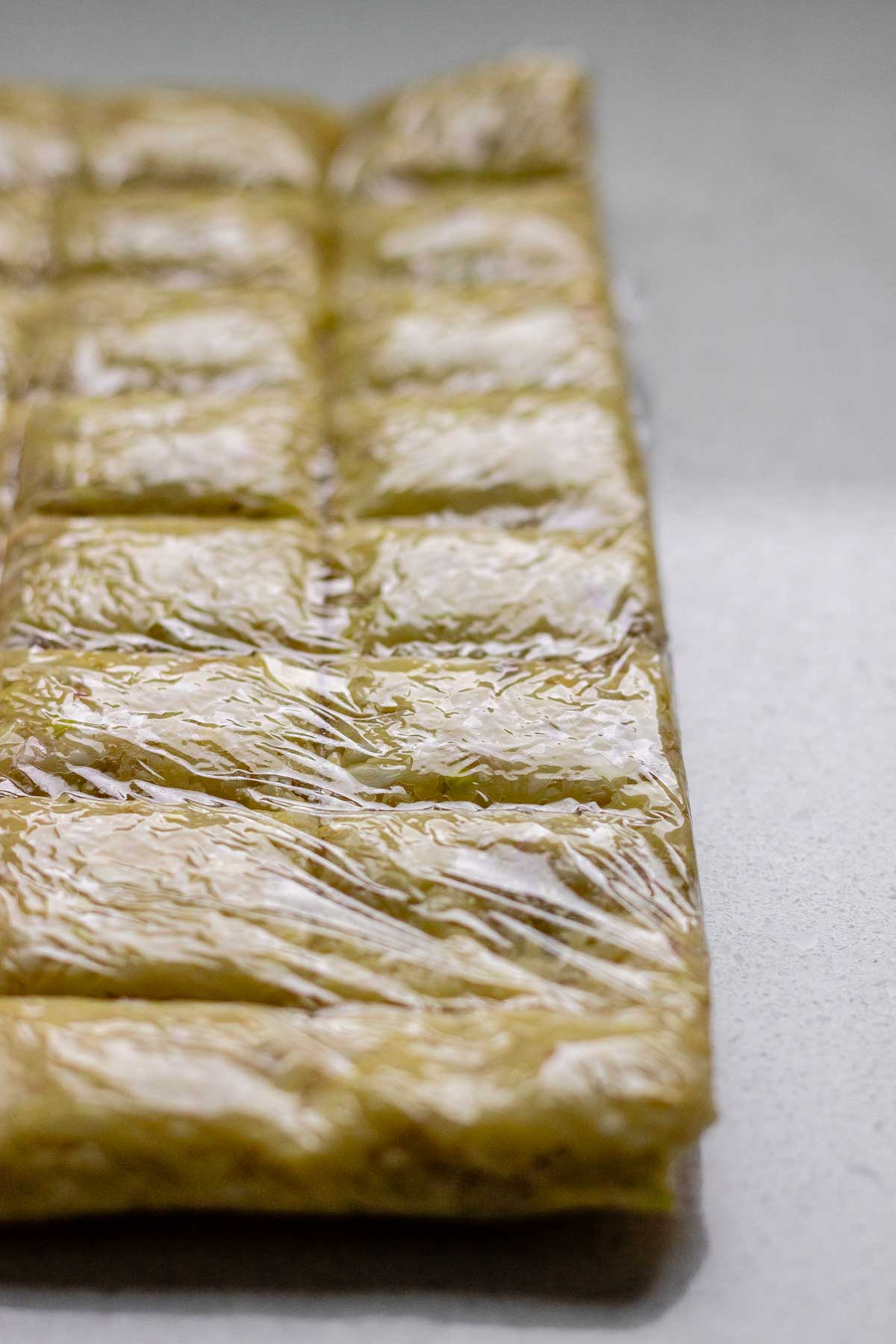 Minced garlic wrapped in plastic wrap.