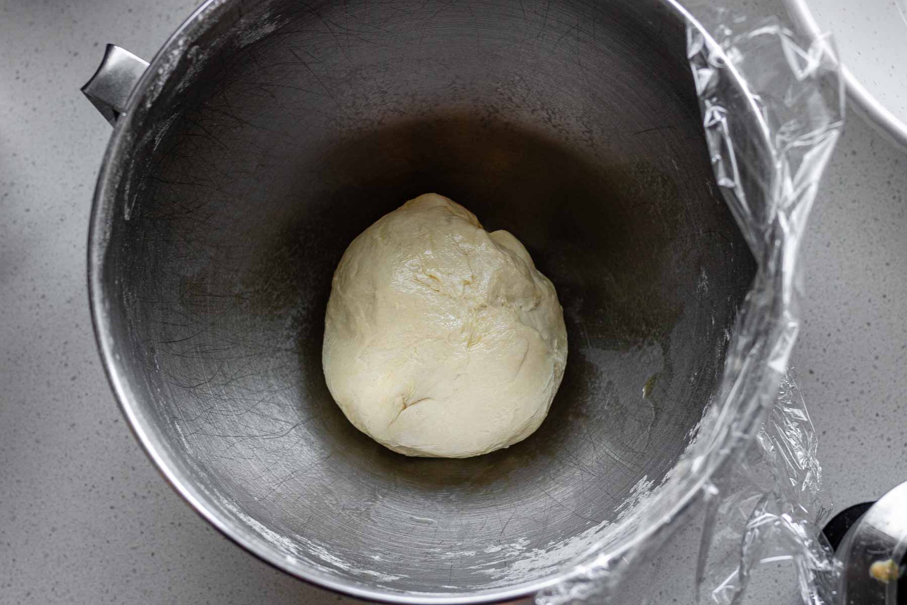 Unrisen dough in a mixing bowl.