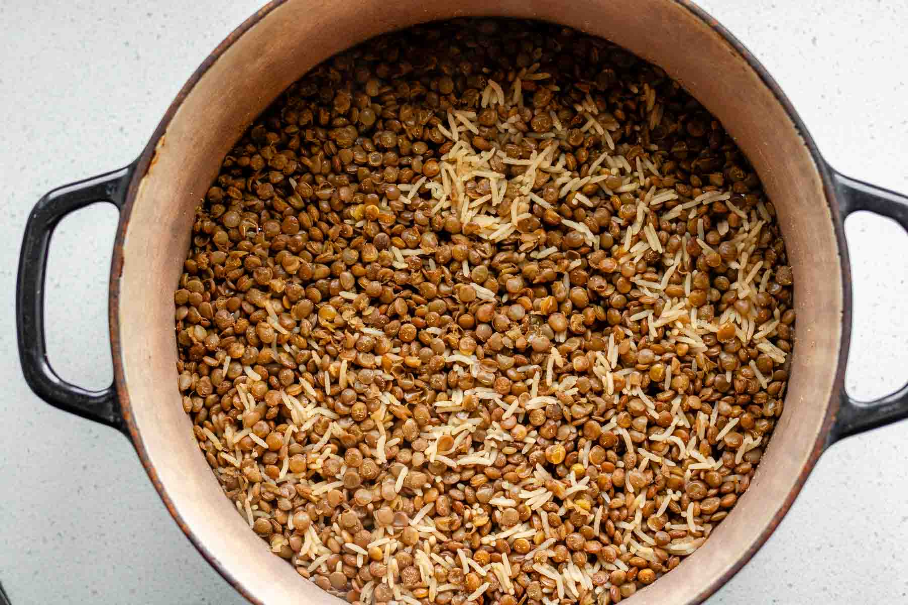 Cooked rice and lentils in a pot.