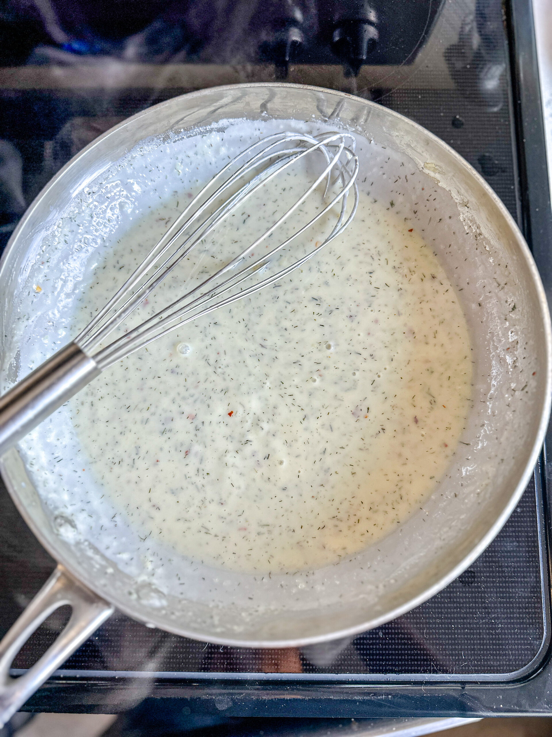 White sauce in a skillet.