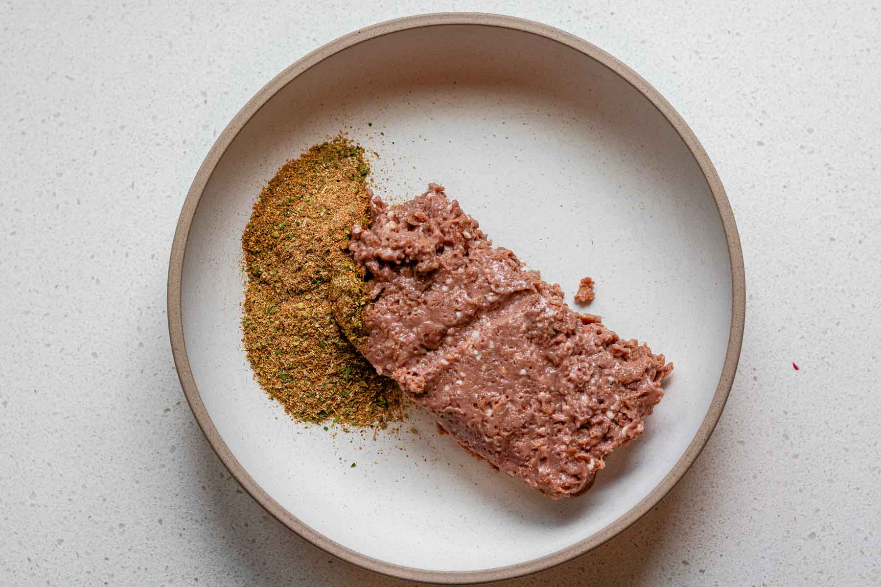Plant based meat and spices in a bowl.