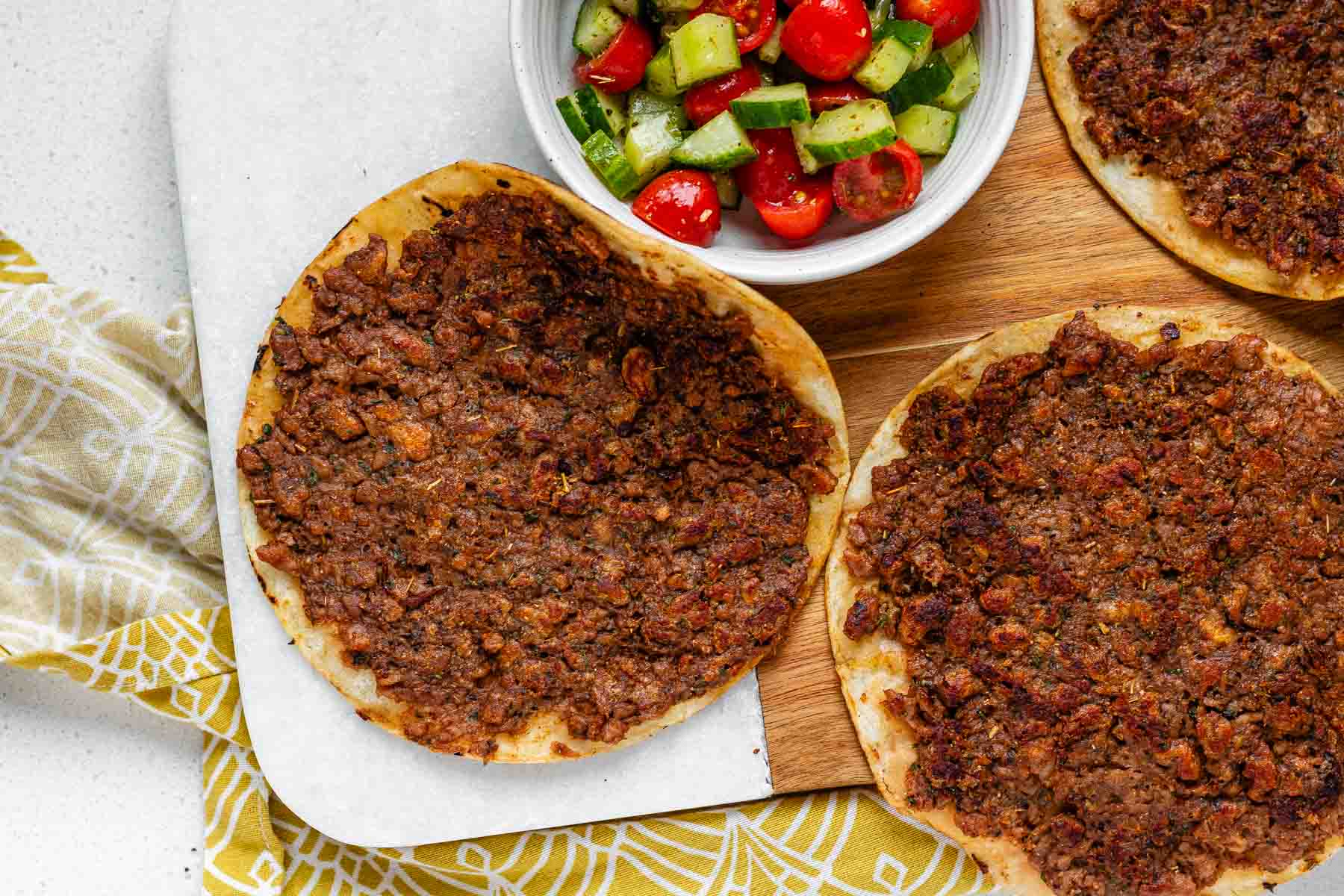 Corn tortillas covered in cooked plant-based meat.