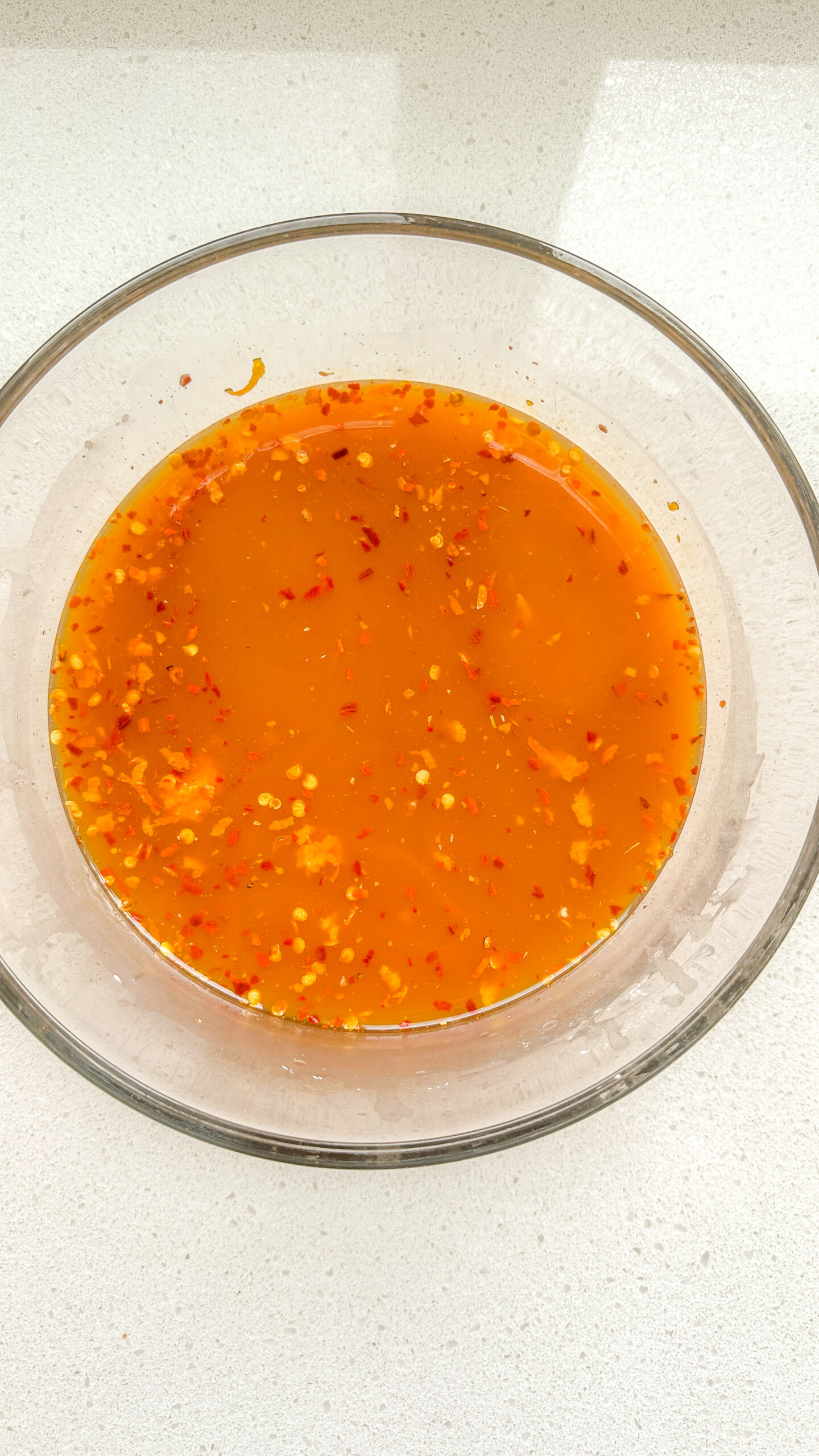 Orange sauce in a bowl.