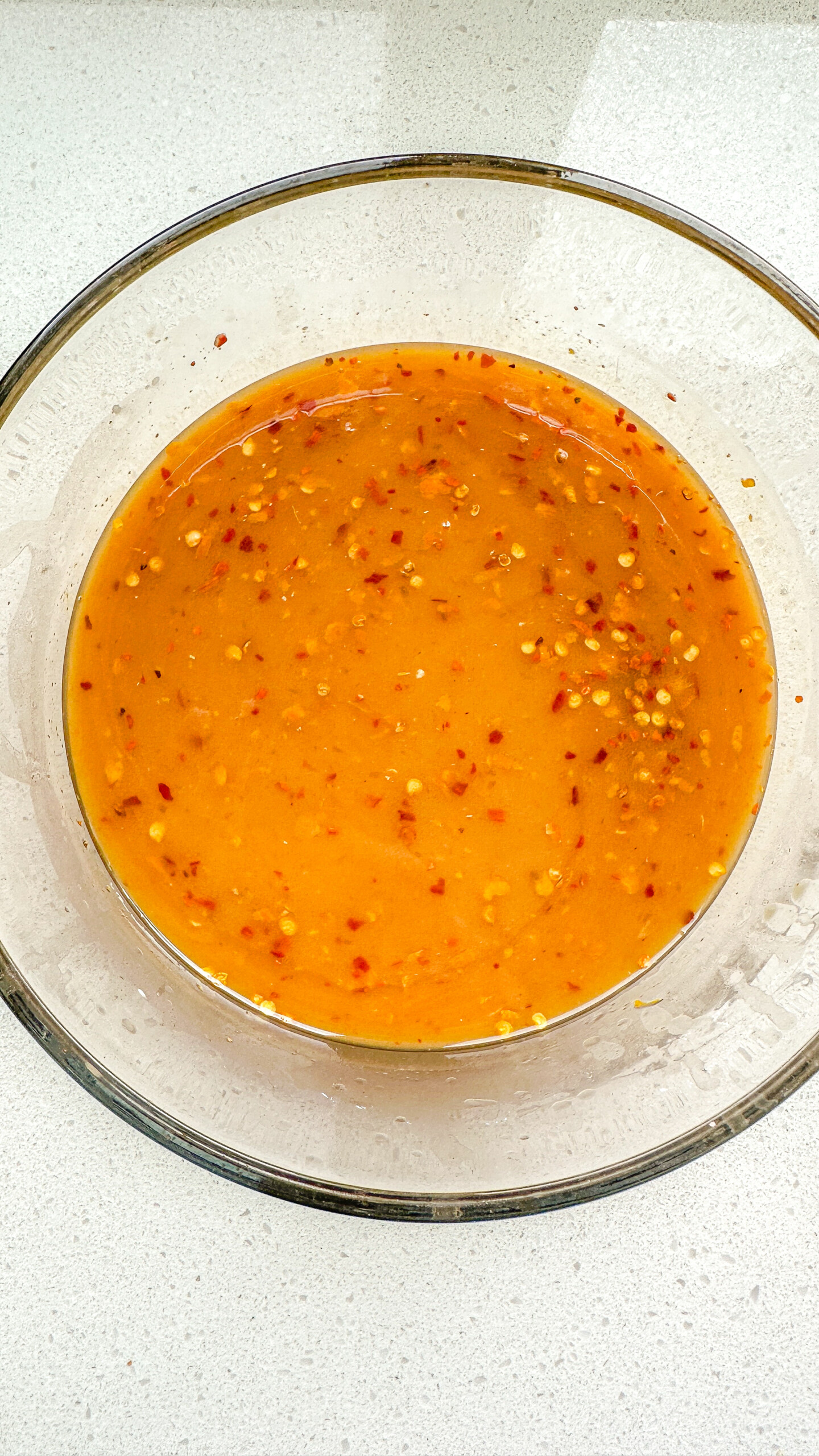 Orange sauce in a bowl.