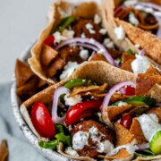 Pita stuffed with meatballs, tomato, cucumber, onion, tzatziki, and crispy pita bits.