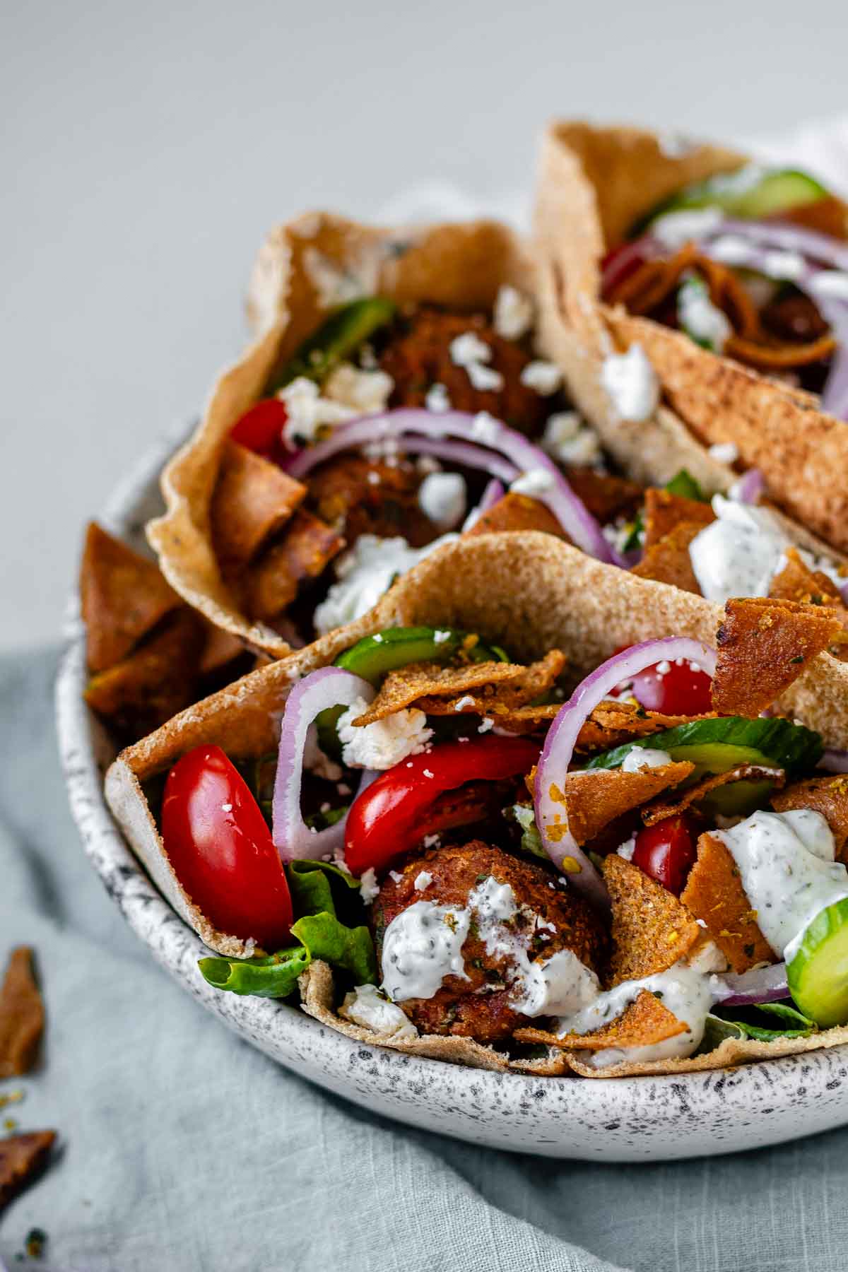 Pita stuffed with meatballs, tomato, cucumber, onion, tzatziki, and crispy pita bits.