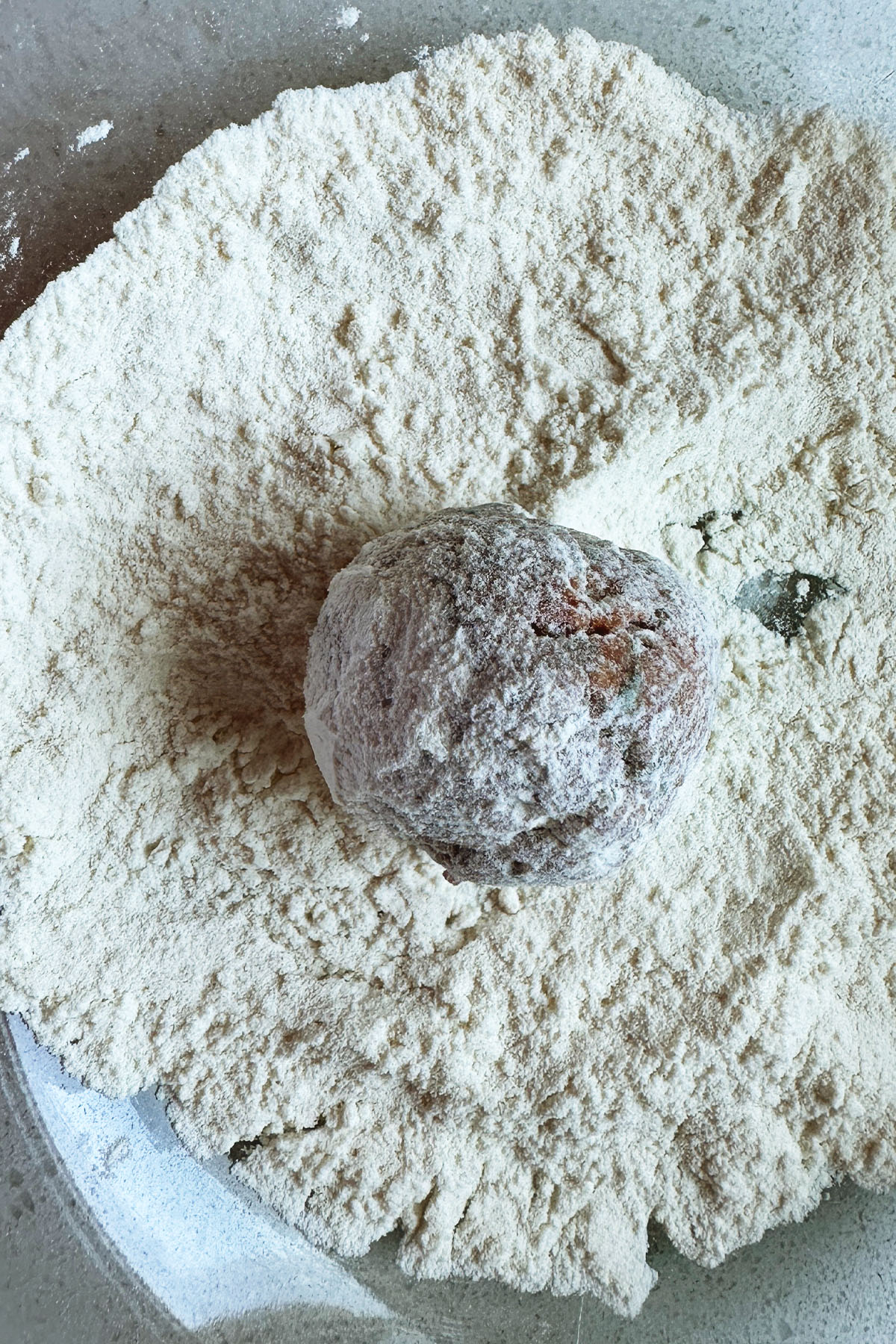 A meatball coated in flour.