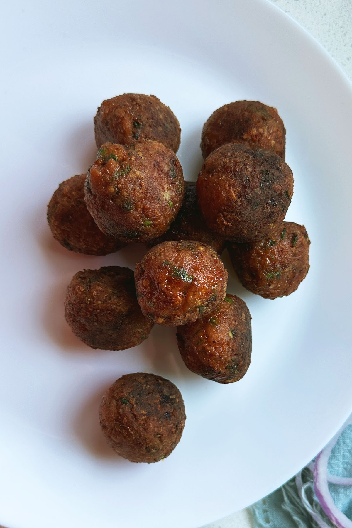 Fried meatballs on a plate.