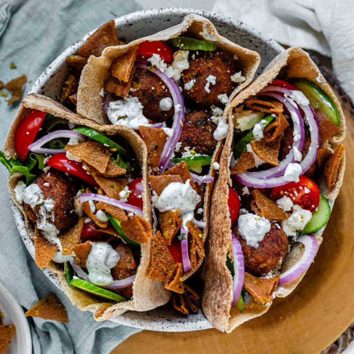 Pita stuffed with meatballs, tomato, cucumber, onion, tzatziki, and crispy pita bits.