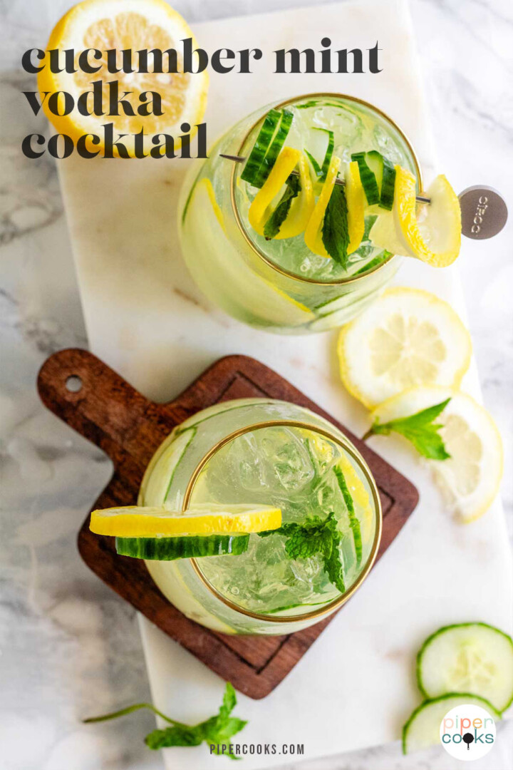 A cocktail garnished with lemon and cucumber slices and fresh mint with the text cucumber mint vodka cocktail.