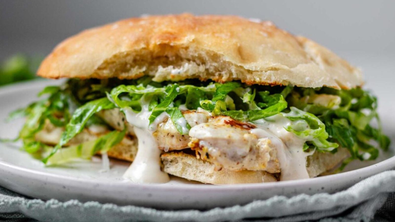 A chicken sandwich on a plate.