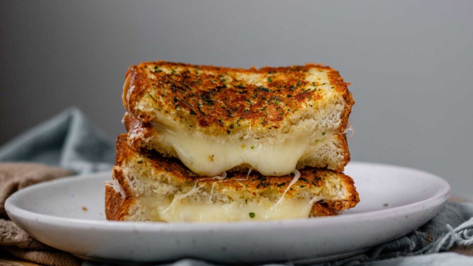 A stacked, halved sandwich on a plate.