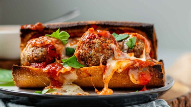 A meatball sandwich on a plate.