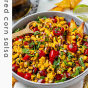 A corn and tomato salsa in a bowl with the text charred corn salsa.