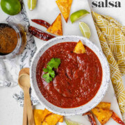 Salsa in a bowl with the text charred grape tomato salsa.