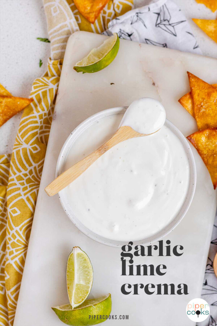 A white sauce in a bowl with the text garlic lime crema.