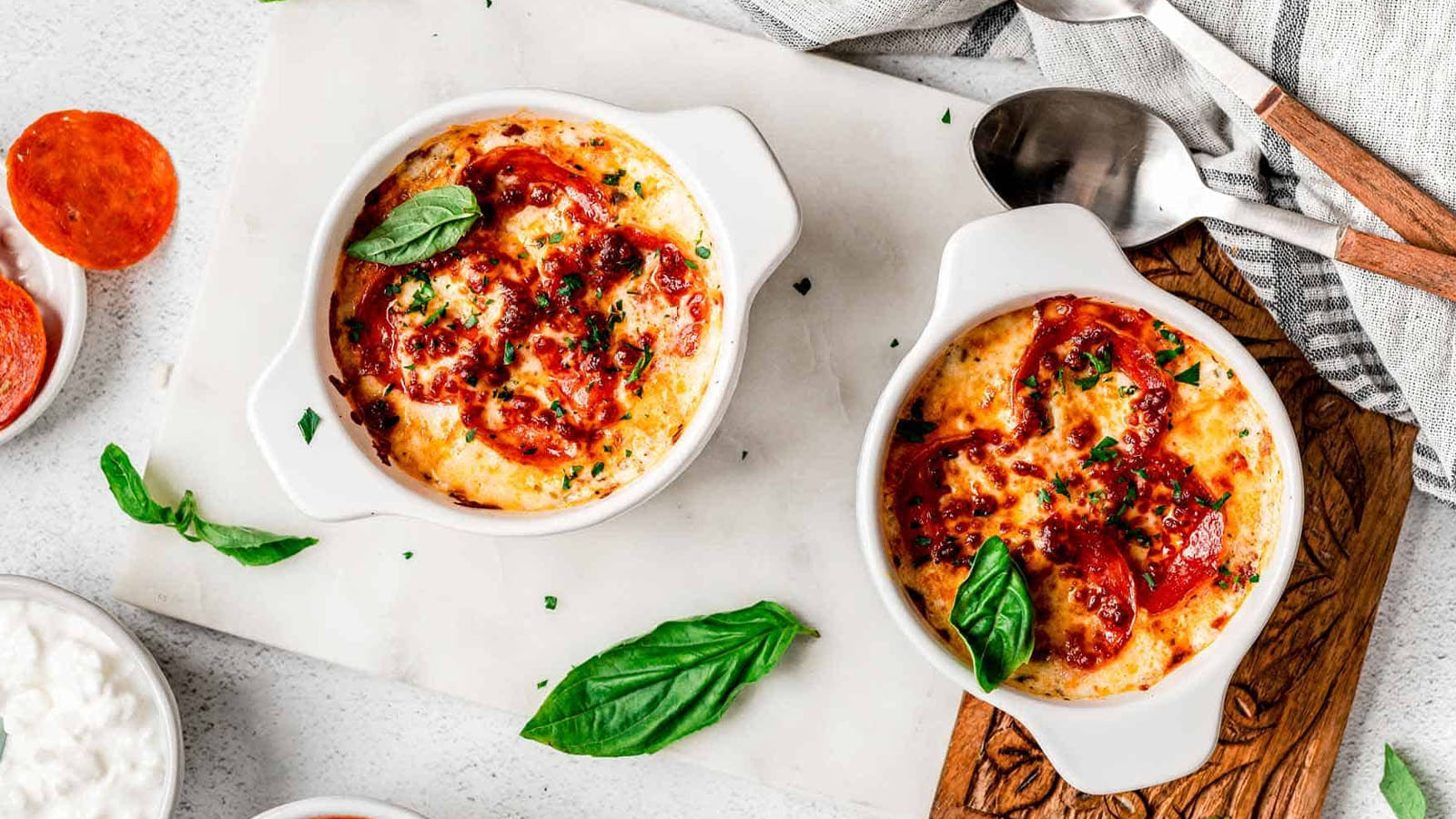Cottage cheese pizza bowl topped with mozzarella, pepperoni, and pizza toppings.