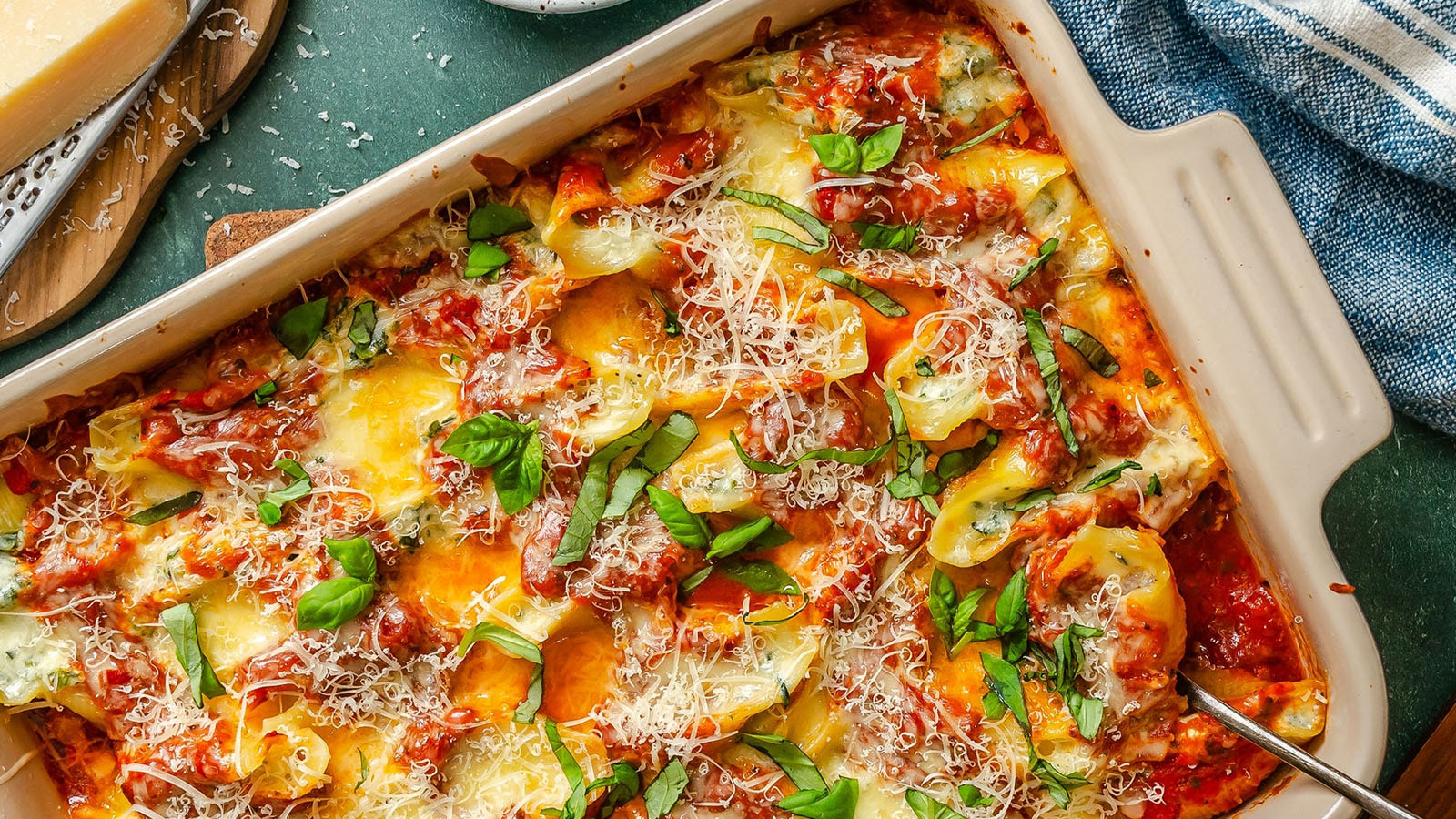 Baked stuffed pasta shells filled with cottage cheese and spinach in tomato sauce.