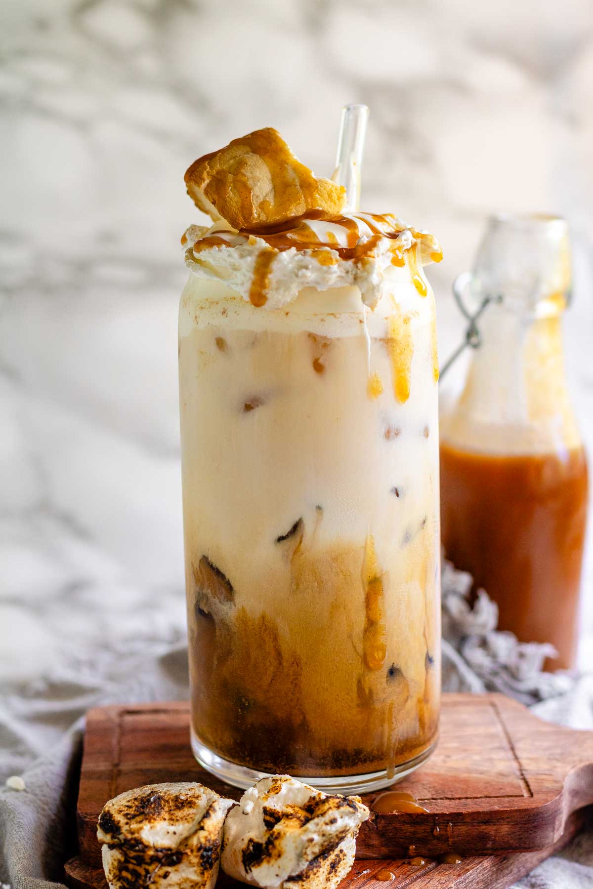 Peanut butter marshmallow iced latte with homemade syrups, topped with toasted marshmallows and peanut butter syrup drizzle.