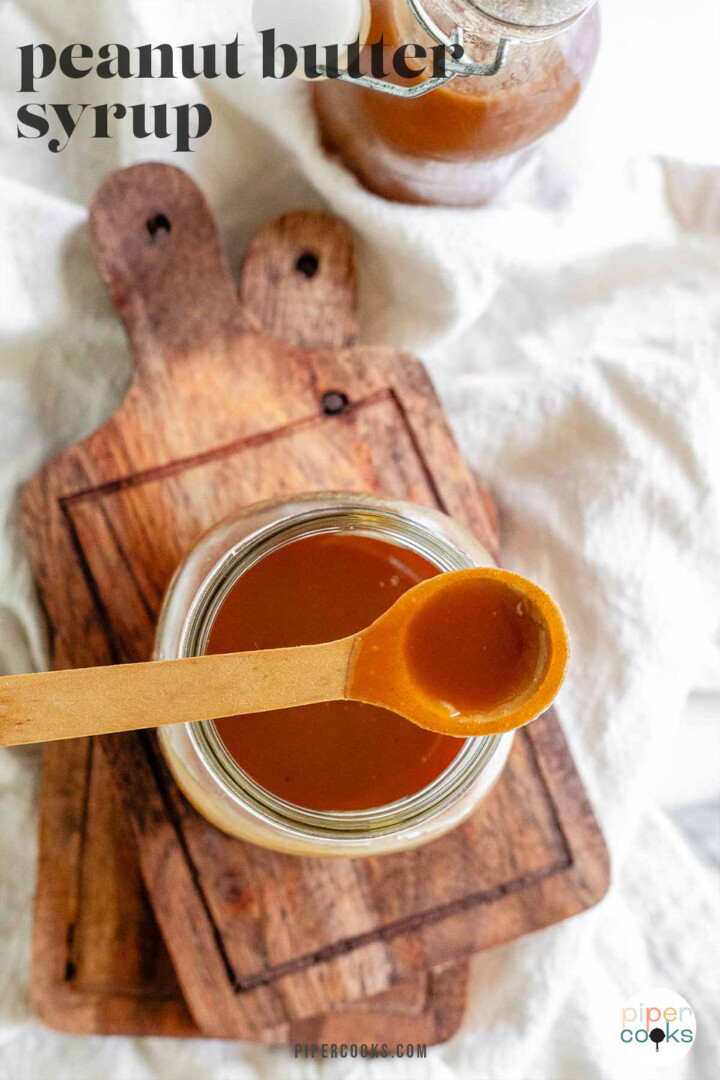 Homemade peanut butter syrup in a glass jar with the text peanut butter syrup.