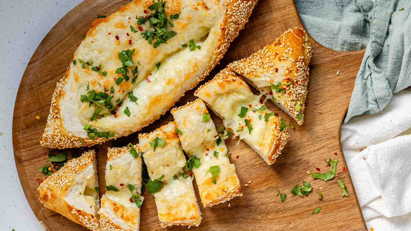 Boat-shaped baked dough filled with melted cheese.