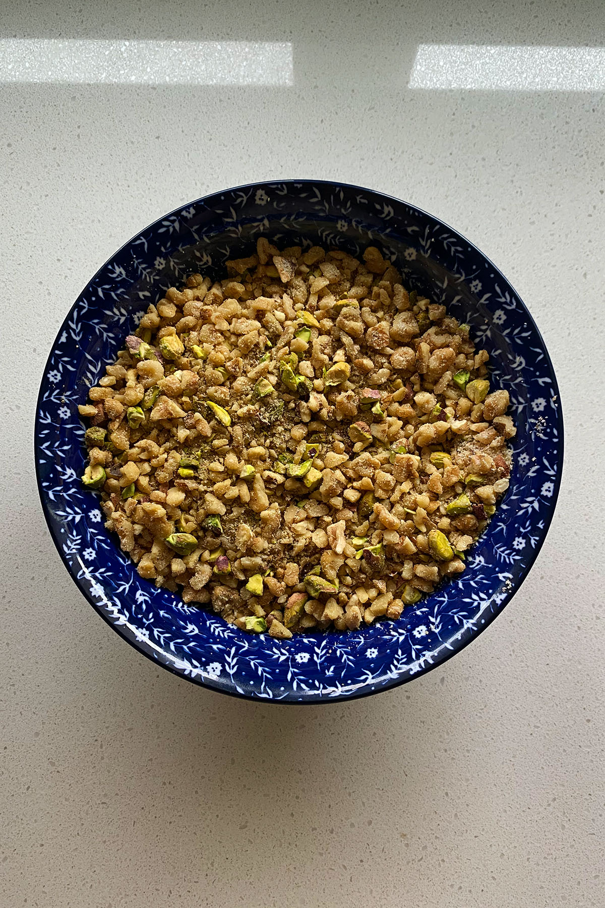 Chopped walnuts and pistachios for baklava filling.