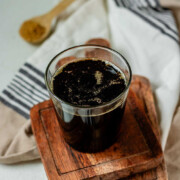 Brown sugar syrup in a glass with the text brown sugar simple syrup.