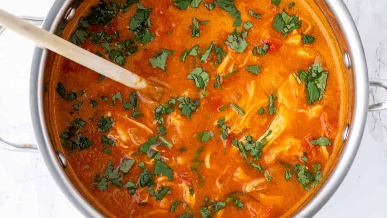 Orange soup in a pot.
