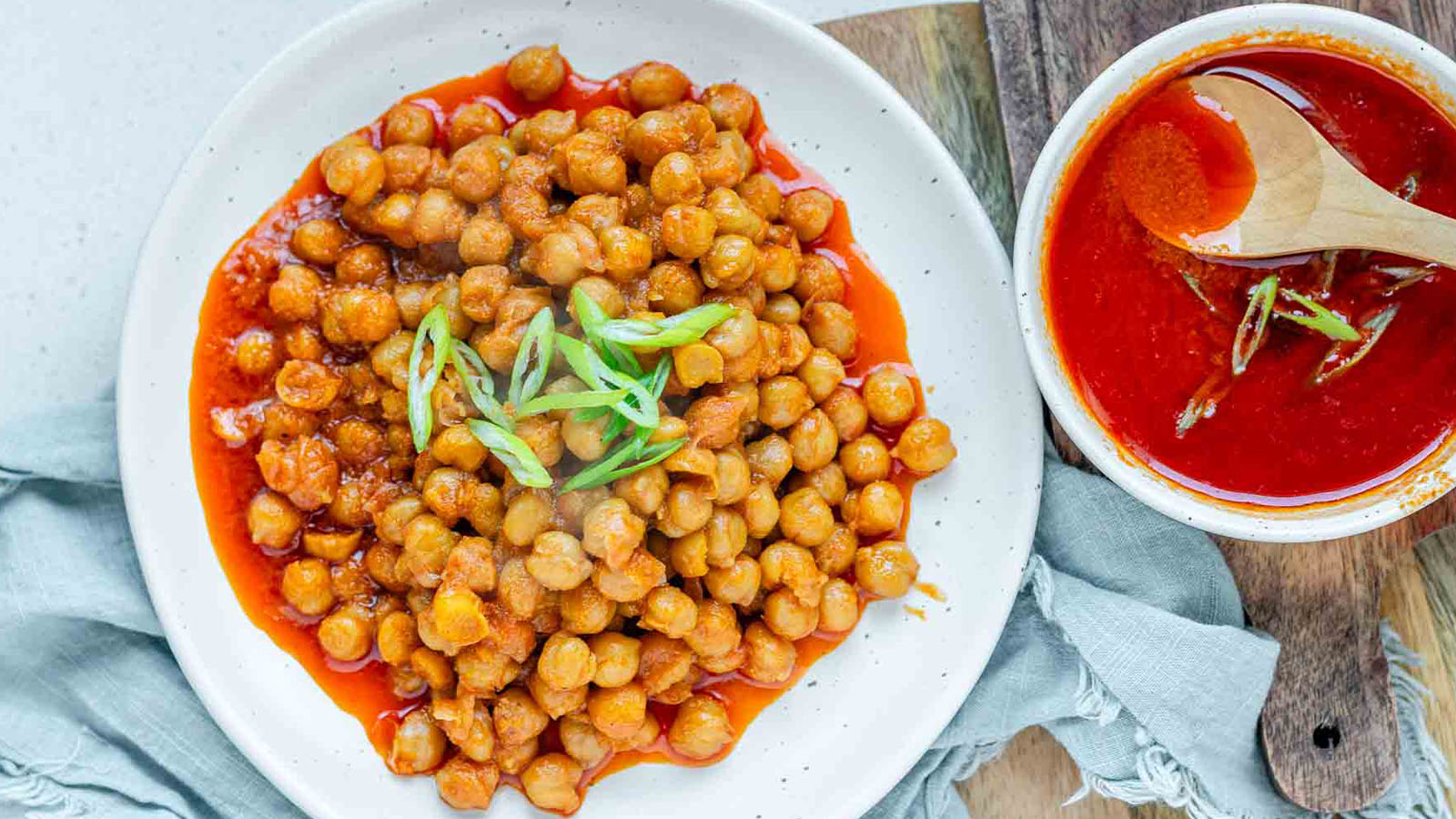 Chickpeas in a red sauce in a bowl.