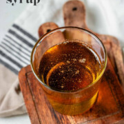 Vanilla bean syrup in a glass with the text vanilla bean syrup.