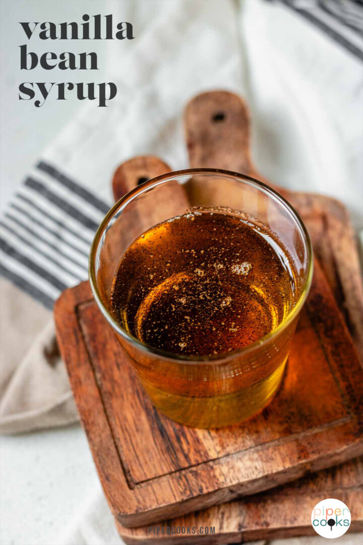 Vanilla bean syrup in a glass with the text vanilla bean syrup.