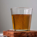Vanilla bean syrup in a glass.