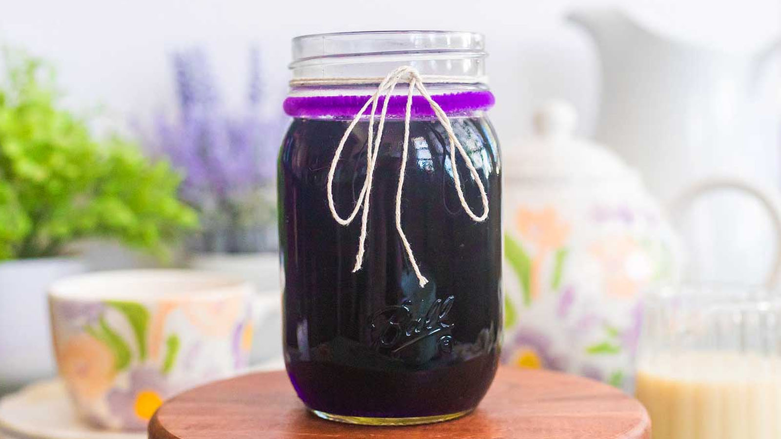 Syrup in a jar tied with twine.
